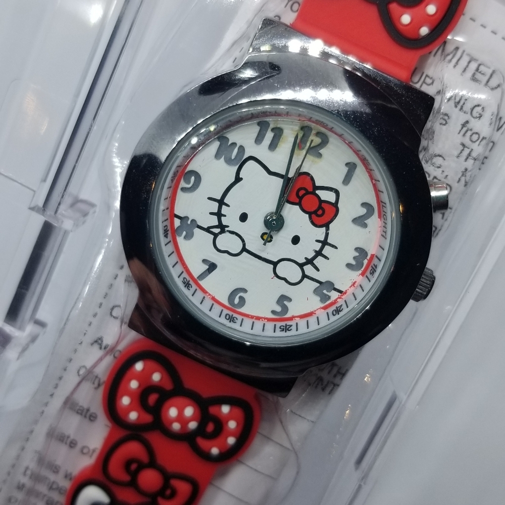 Hello kitty wrist watch (it lights but analog not working )